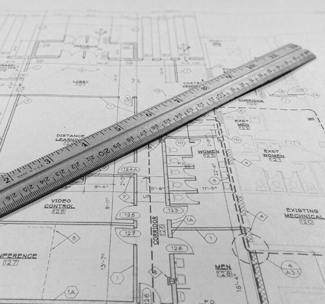 An image of some blueprints with a ruler.